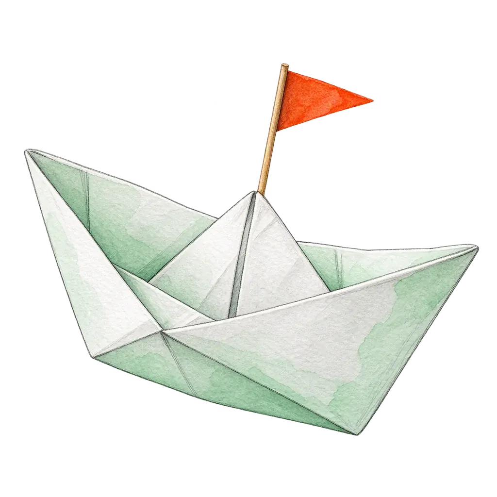 A folded paper boat painted in pale green watercolour, carrying a small orange pennant on a matchstick mast