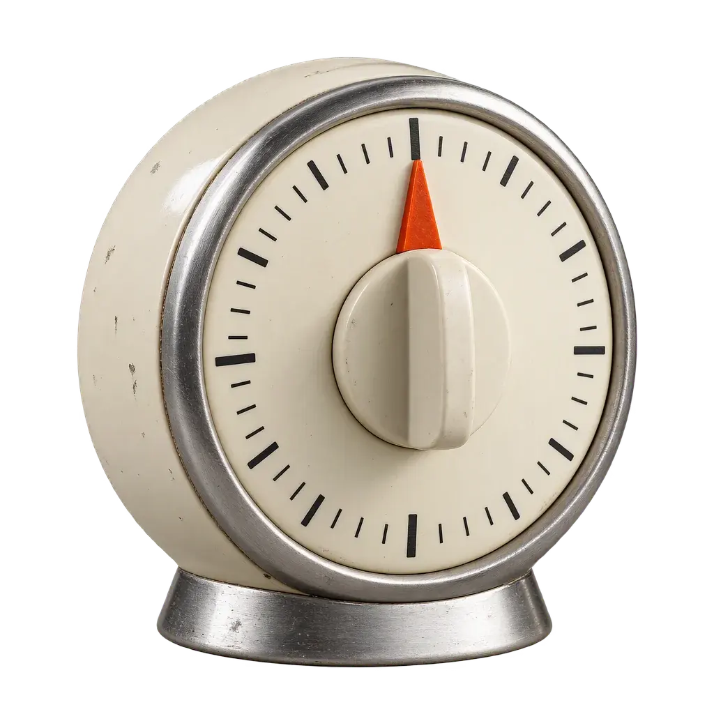 A wind-up kitchen timer with an orange pointer