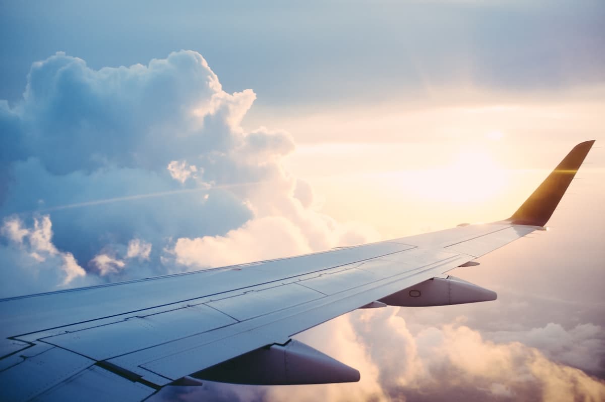 Airplane wing at sunset